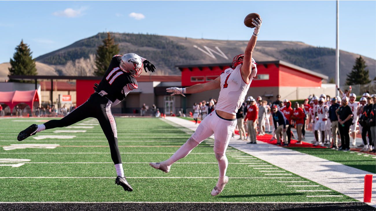 ThunderWolves Football Player catching ball